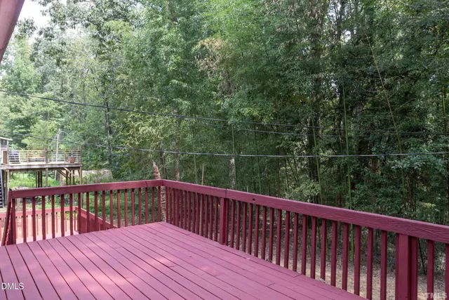 a view of a pathway of a wooden bridge