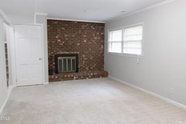 an empty room with a fireplace