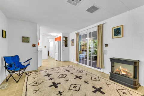 a bedroom with furniture and painting on the wall