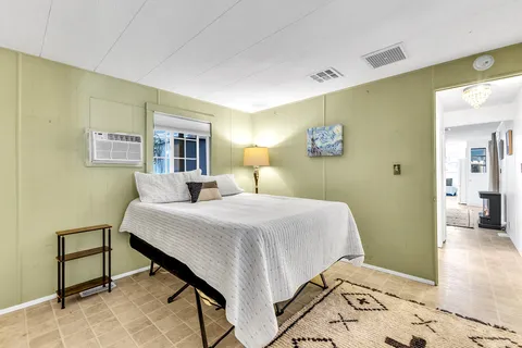 a view of a chairs and table in the backyard