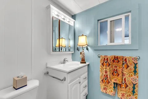 a view of a chairs and table in a backyard