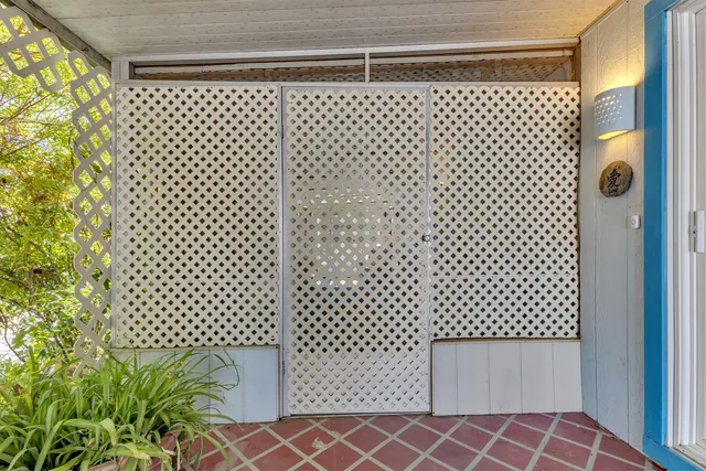 a kitchen with stainless steel appliances kitchen island granite countertop a stove a sink and a refrigerator
