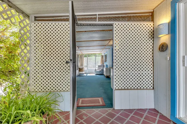 a bathroom with a shower and a sink