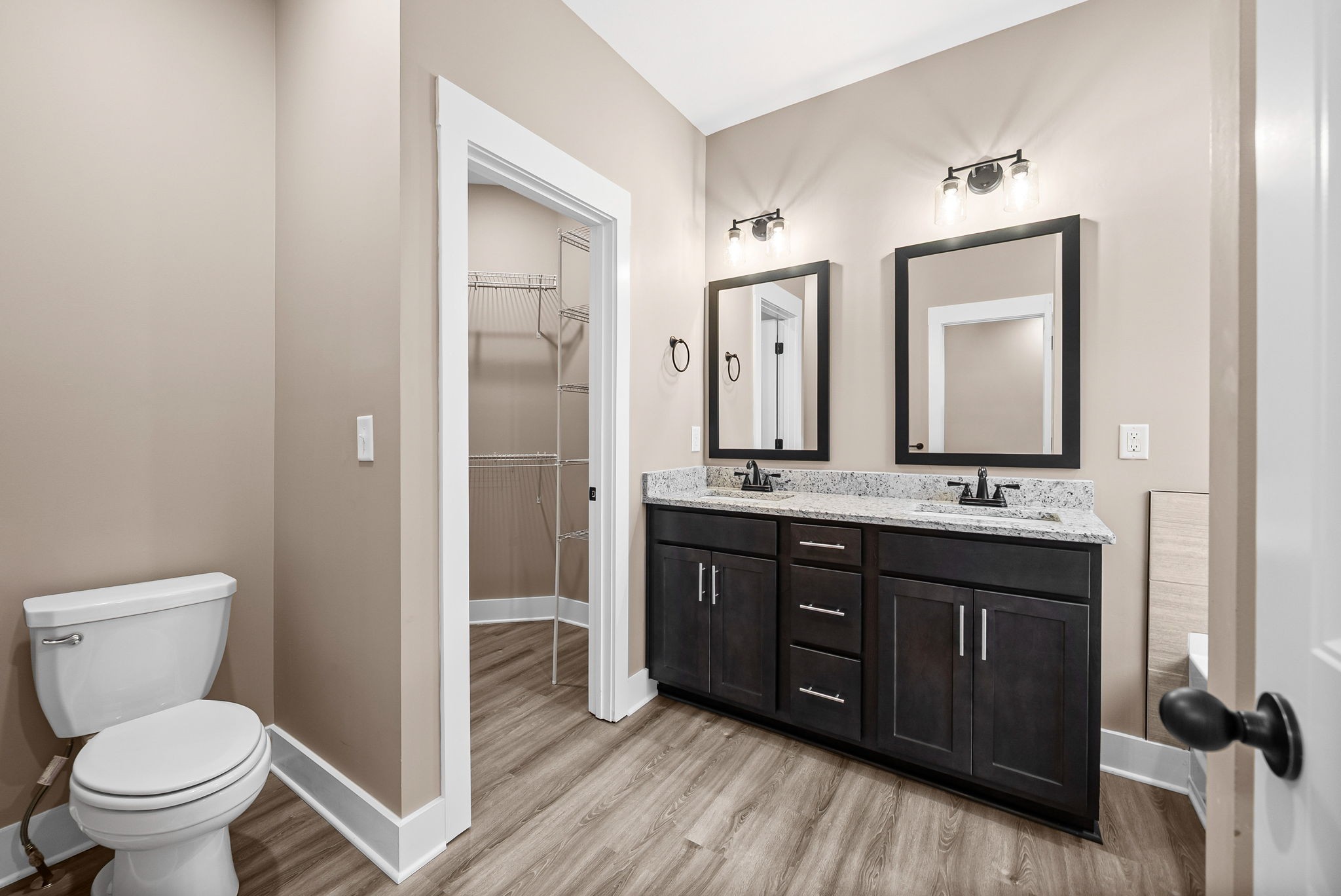 369 Timber Springs Clarksville, TN 37042 - Photo 11 of 23 a bathroom with a double vanity sink a toilet and a mirror