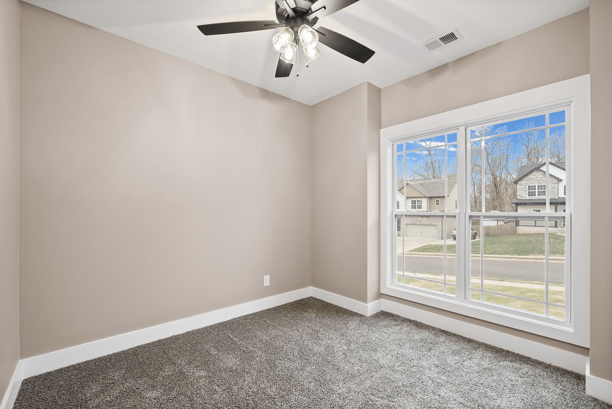369 Timber Springs Clarksville, TN 37042 - Photo 13 of 23 an empty room with a ceiling fan and windows