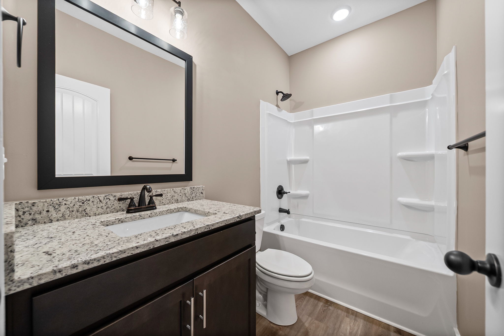 369 Timber Springs Clarksville, TN 37042 - Photo 16 of 23 a bathroom with a granite countertop sink a mirror a toilet and bathtub