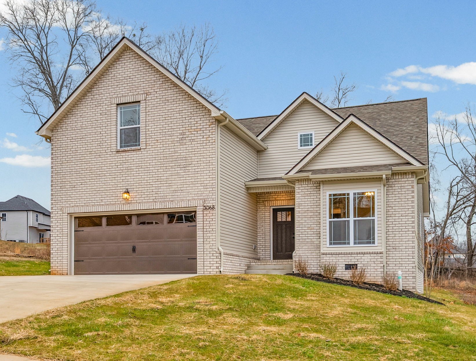 369 Timber Springs Clarksville, TN 37042 - Photo 2 of 23 a view of a house with a yard and a garage