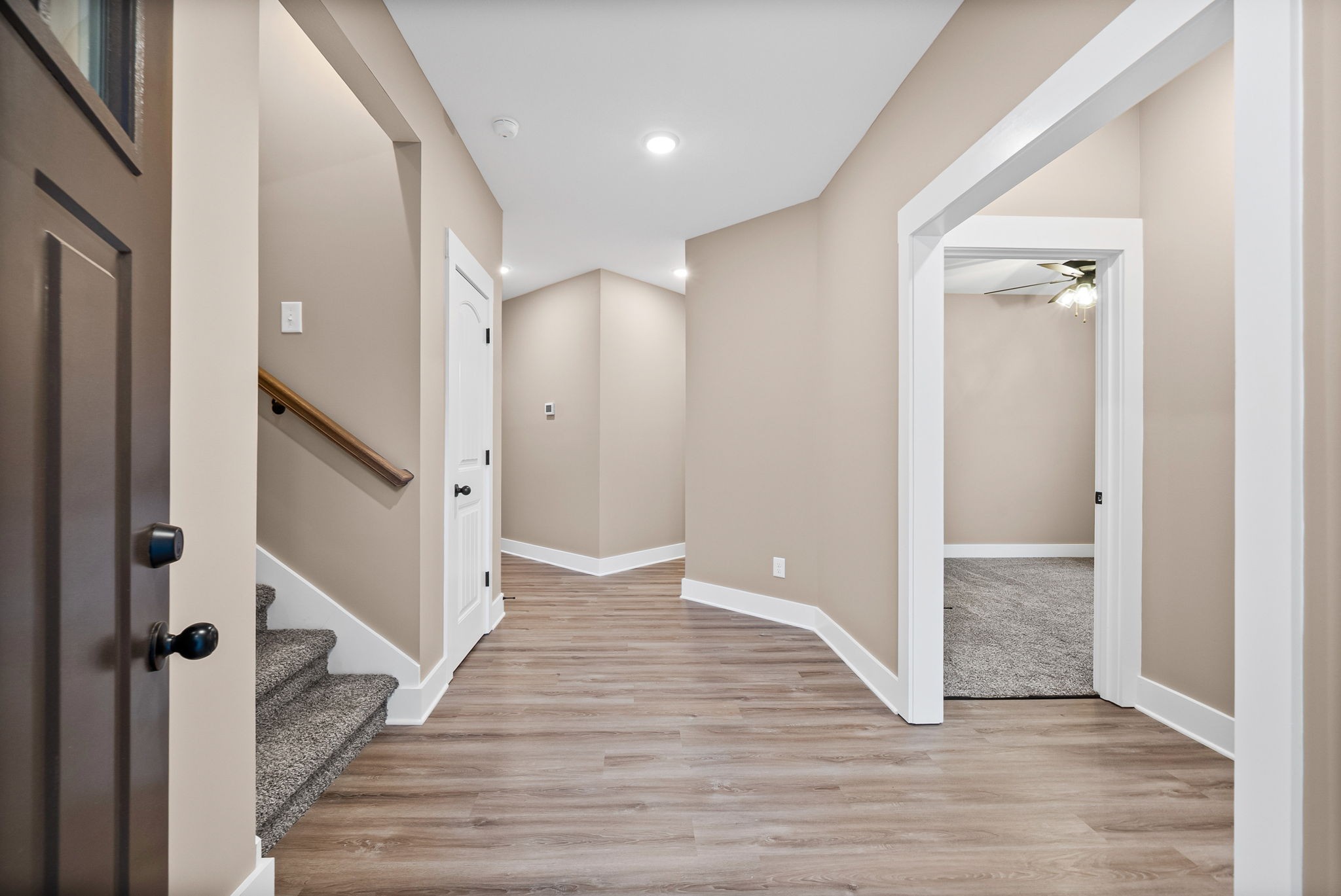 369 Timber Springs Clarksville, TN 37042 - Photo 3 of 23 a view of a hallway with wooden floor and staircase
