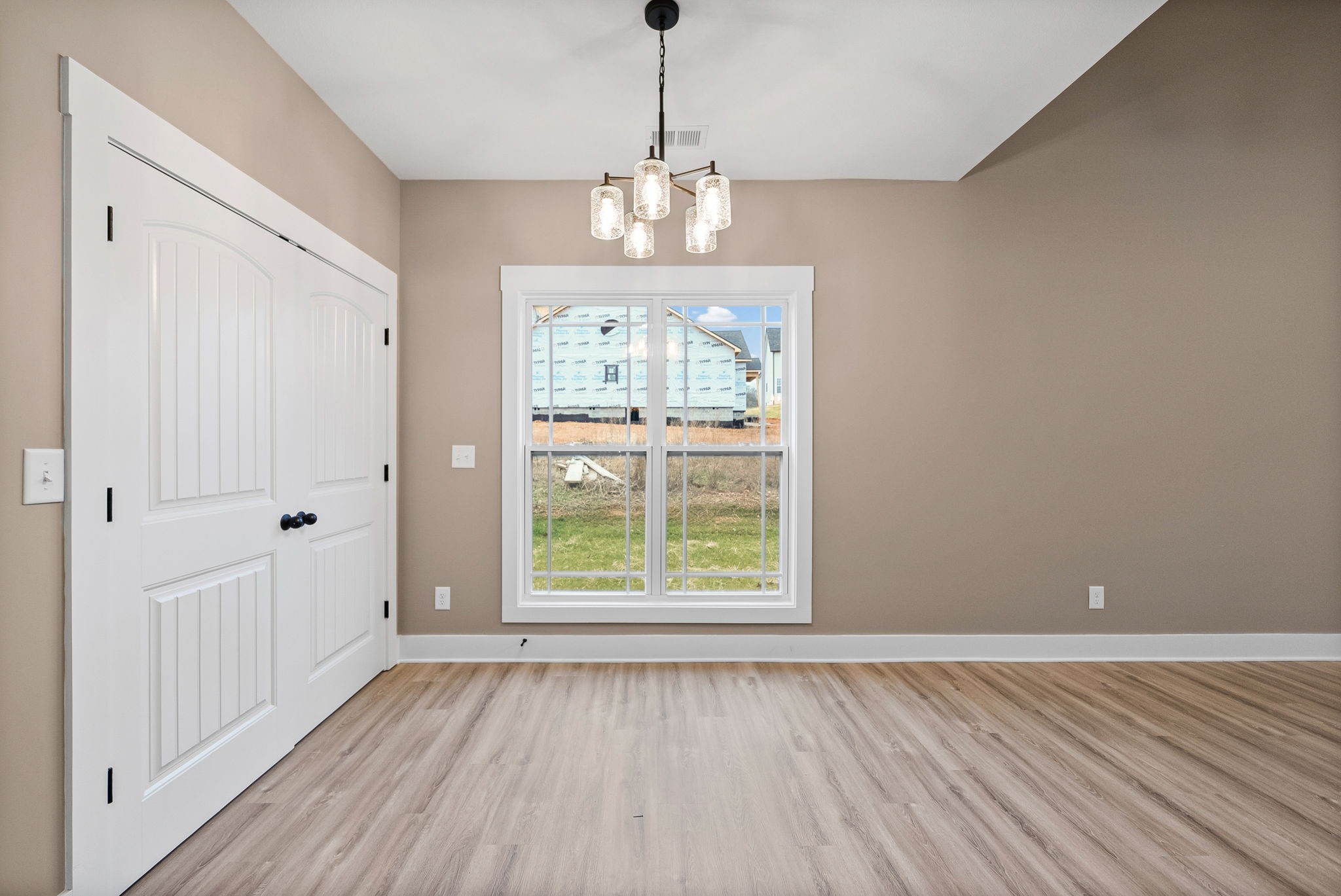 369 Timber Springs Clarksville, TN 37042 - Photo 7 of 23 a view of an empty room with wooden floor and a window