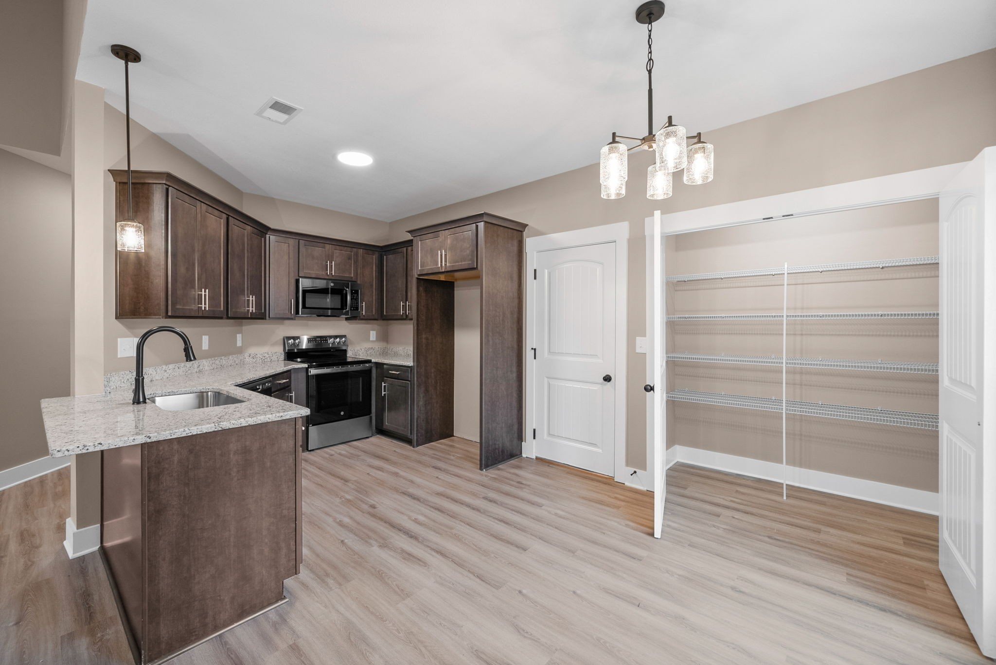 369 Timber Springs Clarksville, TN 37042 - Photo 8 of 23 a large kitchen with kitchen island a sink stainless steel appliances and cabinets