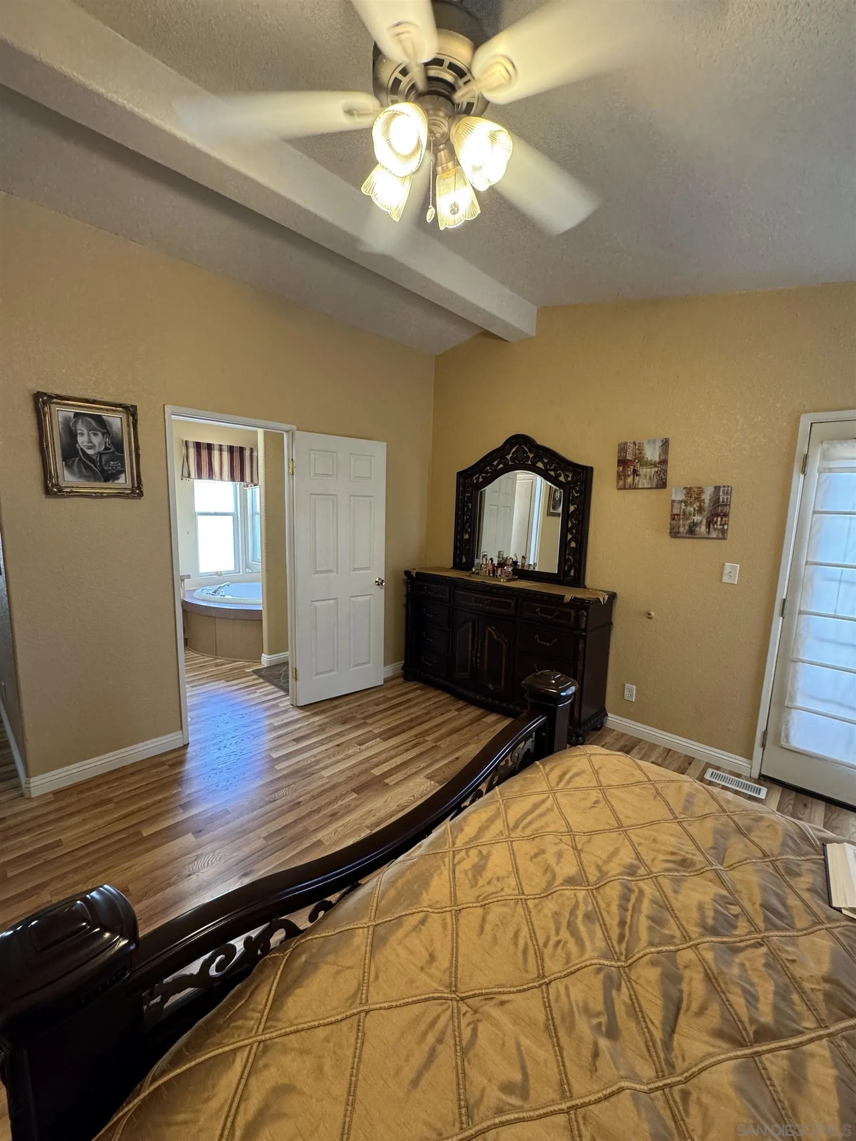 12250 Vista Del Cajon Road, Unit 25 El Cajon, CA 92021 - Photo 13 of 39 a bedroom with a bed and wooden floor