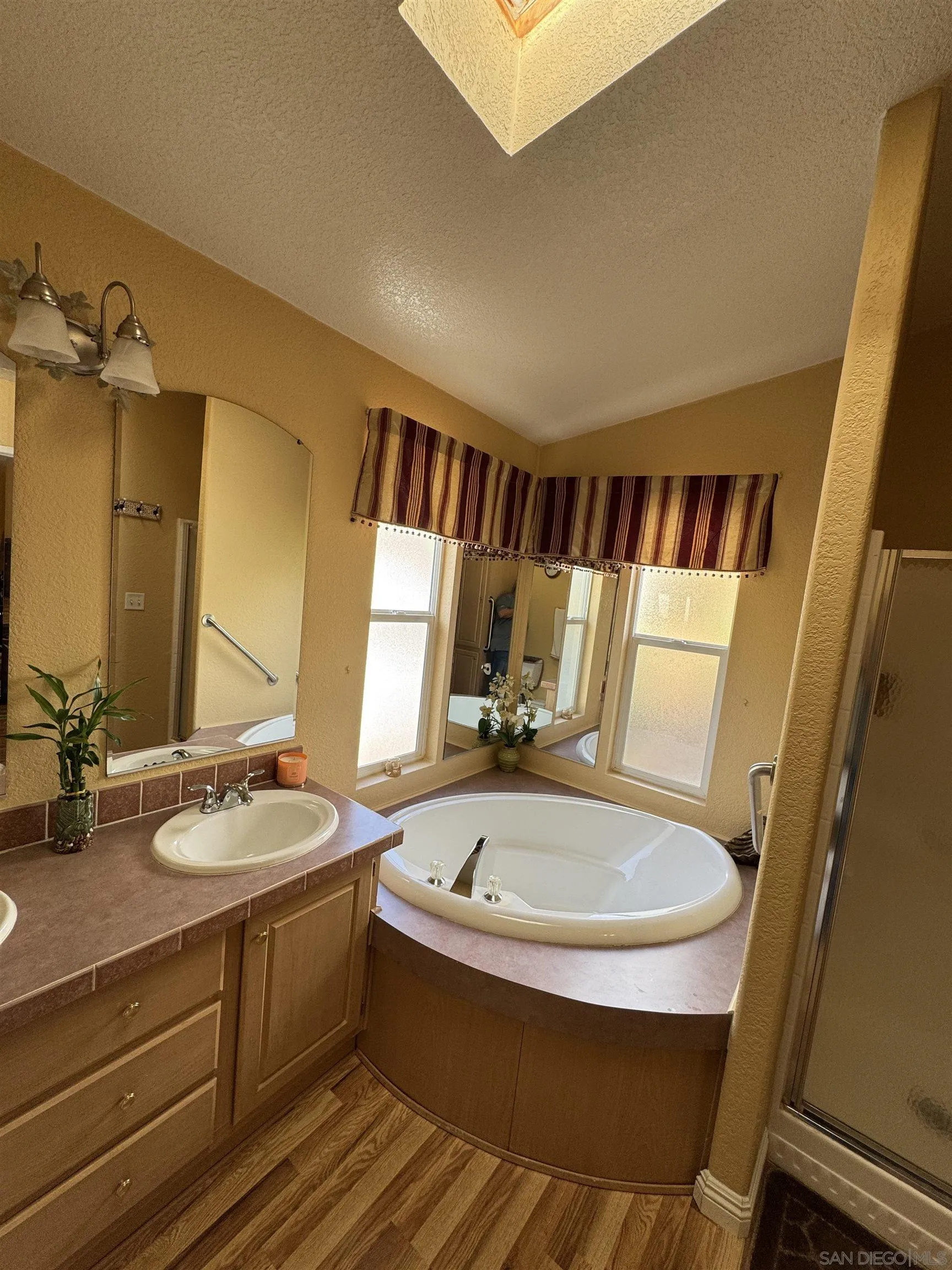 12250 Vista Del Cajon Road, Unit 25 El Cajon, CA 92021 - Photo 20 of 39 a bathroom with a sink and a mirror