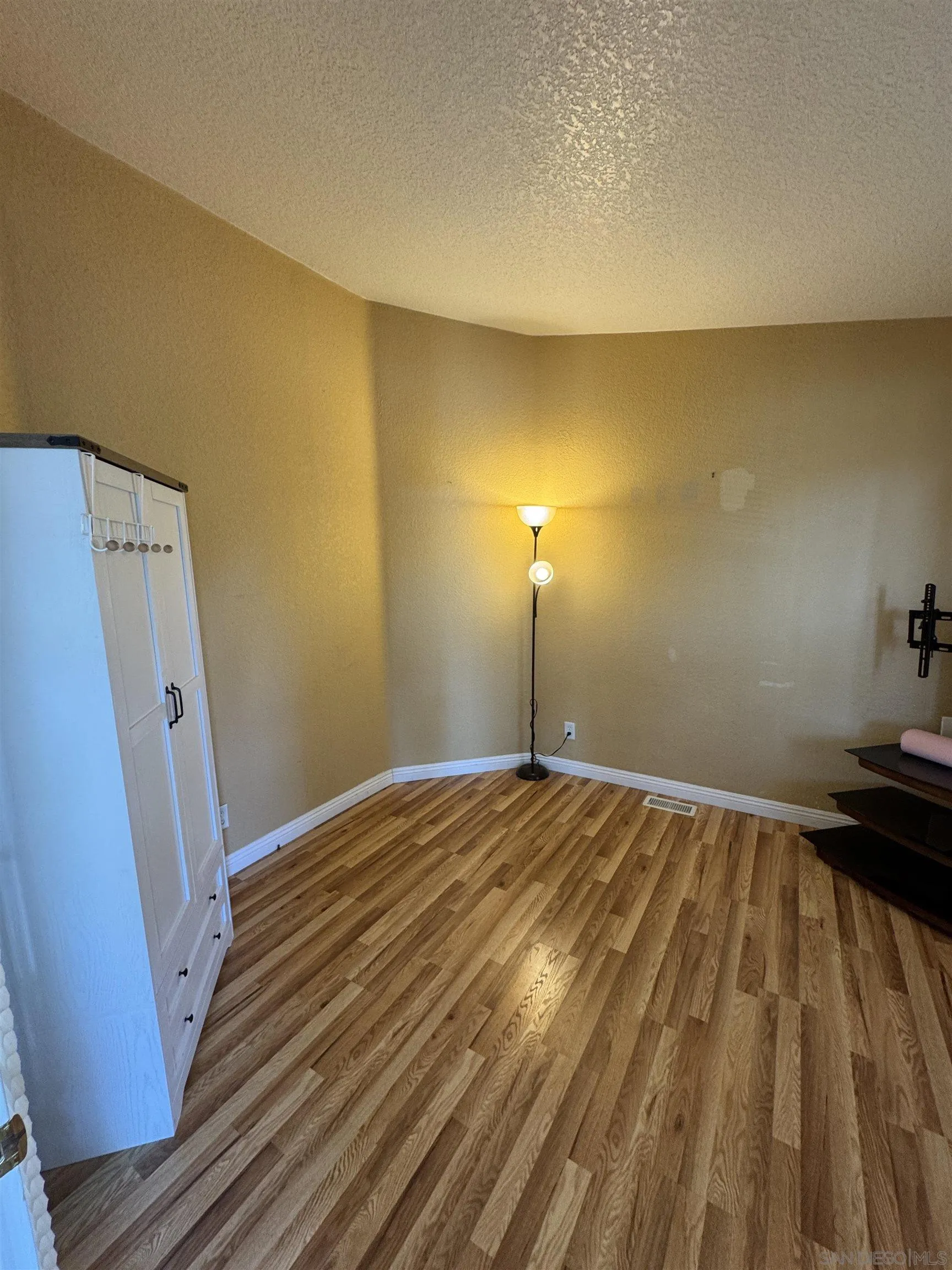 12250 Vista Del Cajon Road, Unit 25 El Cajon, CA 92021 - Photo 25 of 39 a view of empty room with wooden floor