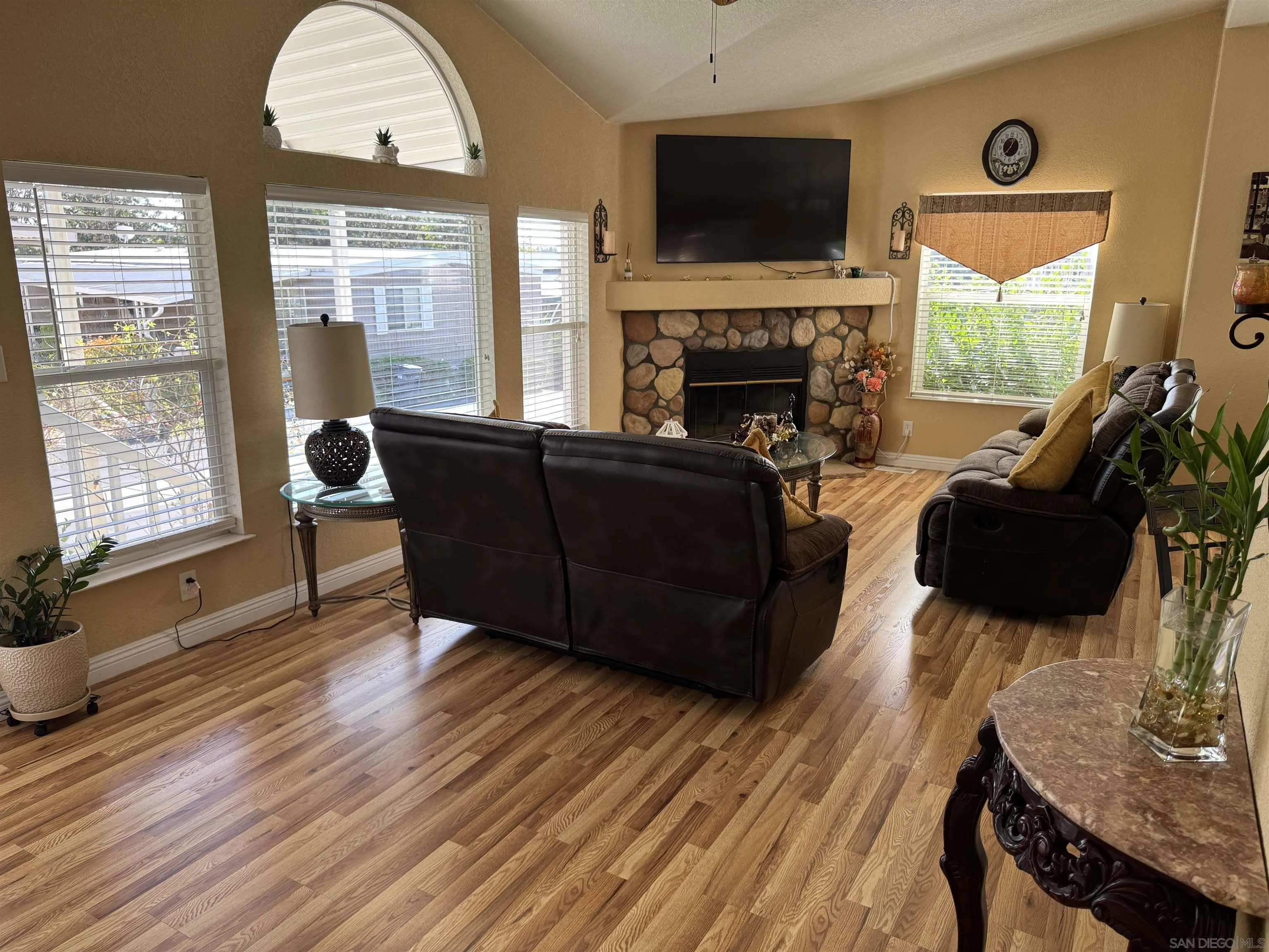 12250 Vista Del Cajon Road, Unit 25 El Cajon, CA 92021 - Photo 3 of 39 a living room with furniture fireplace and flat screen tv