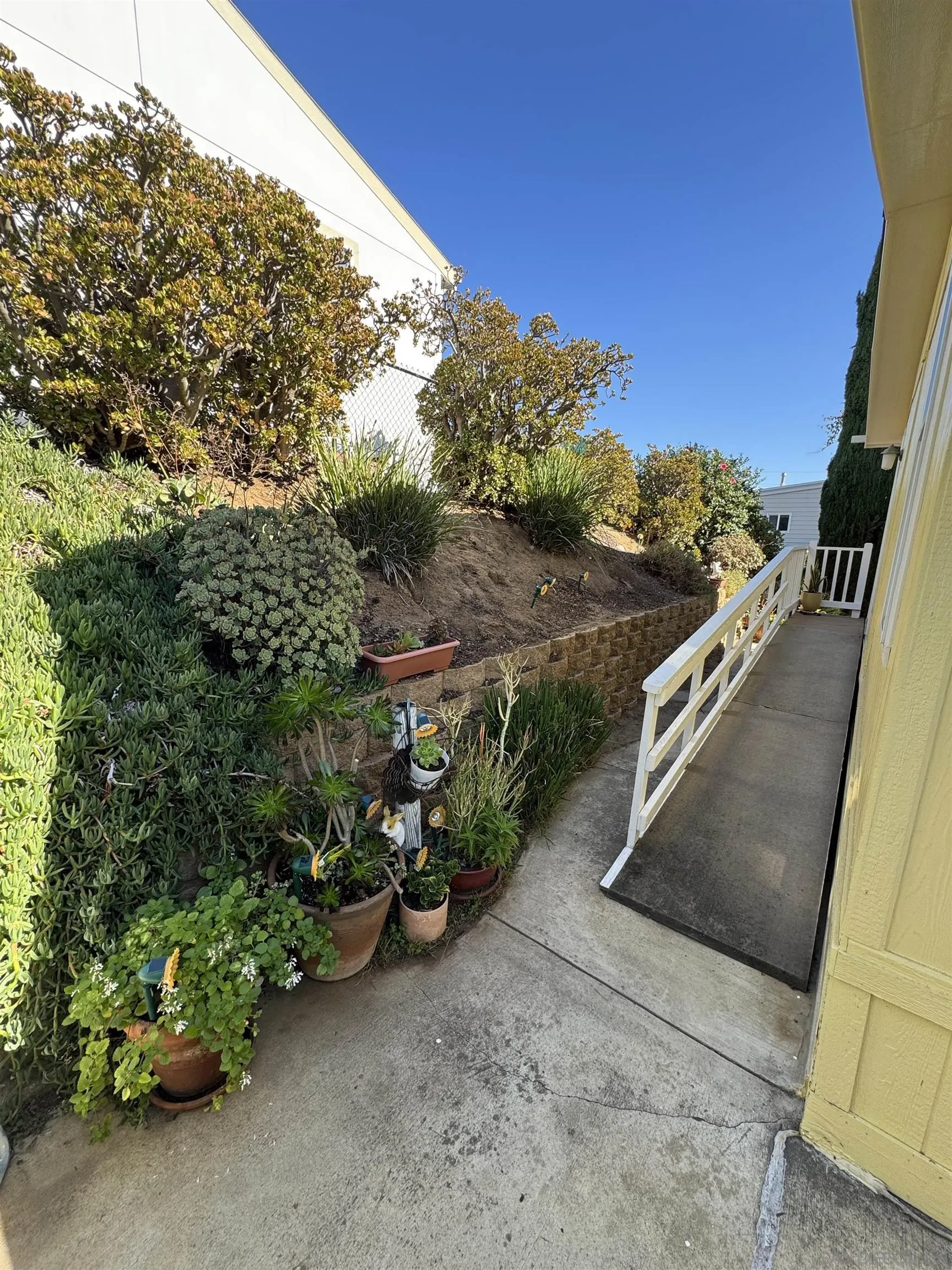 12250 Vista Del Cajon Road, Unit 25 El Cajon, CA 92021 - Photo 34 of 39 a view of a garden with an outdoor seating