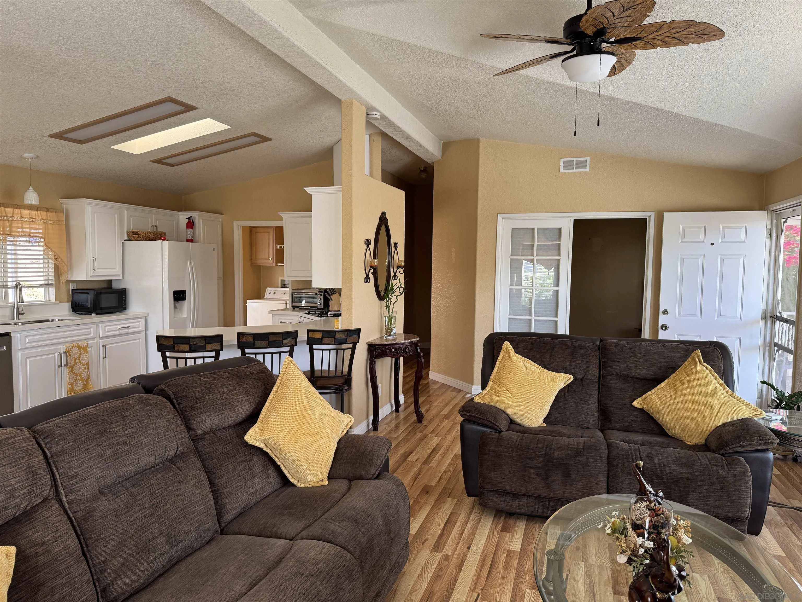 12250 Vista Del Cajon Road, Unit 25 El Cajon, CA 92021 - Photo 5 of 39 a living room with furniture and wooden floor