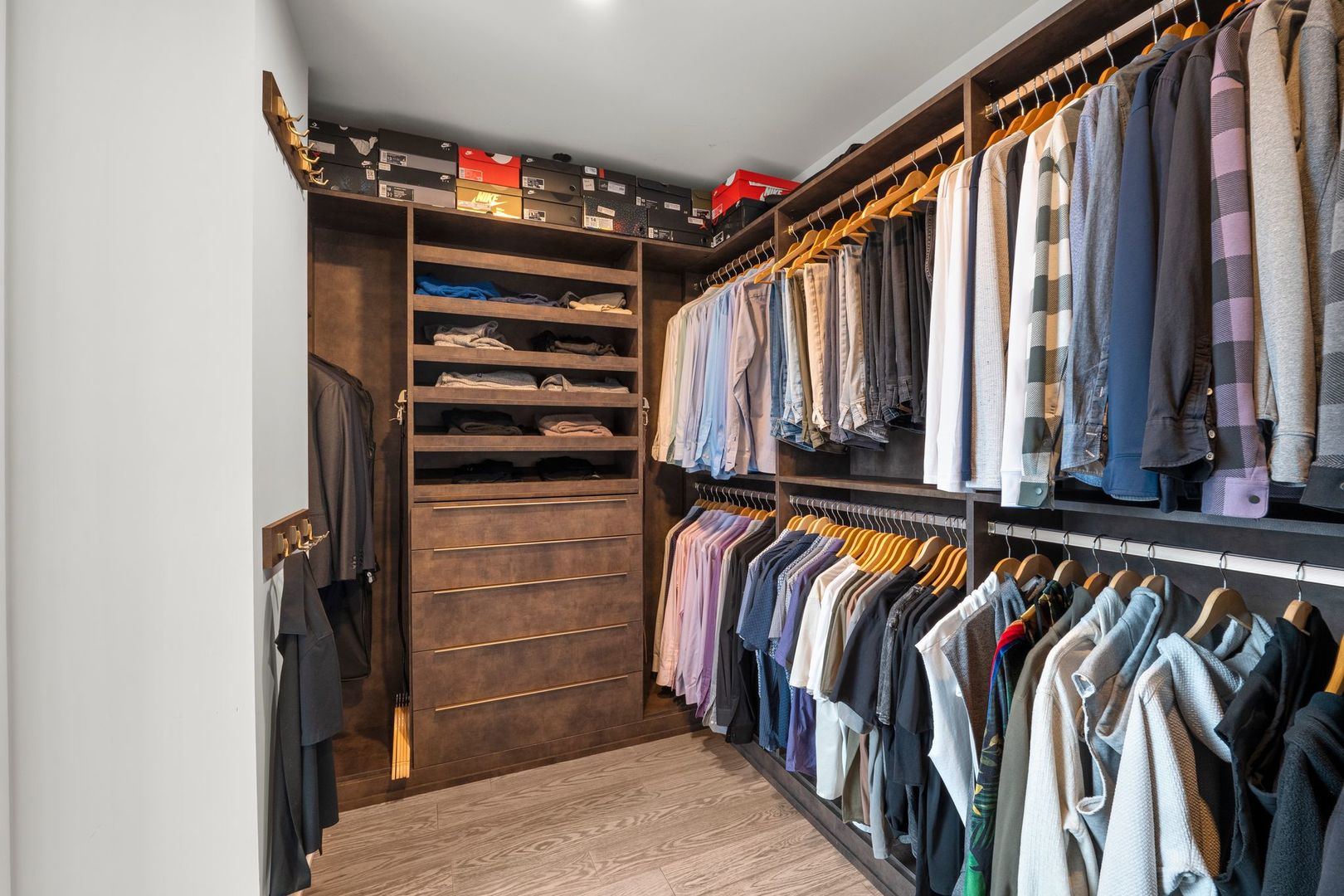 403 North Wabash Avenue, Unit 17C Chicago, IL 60611 - Photo 13 of 30 a view of walk in closet with clothes and shoes