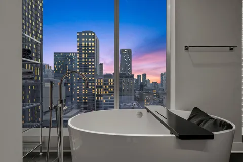 a bathroom with a bathtub and a shower