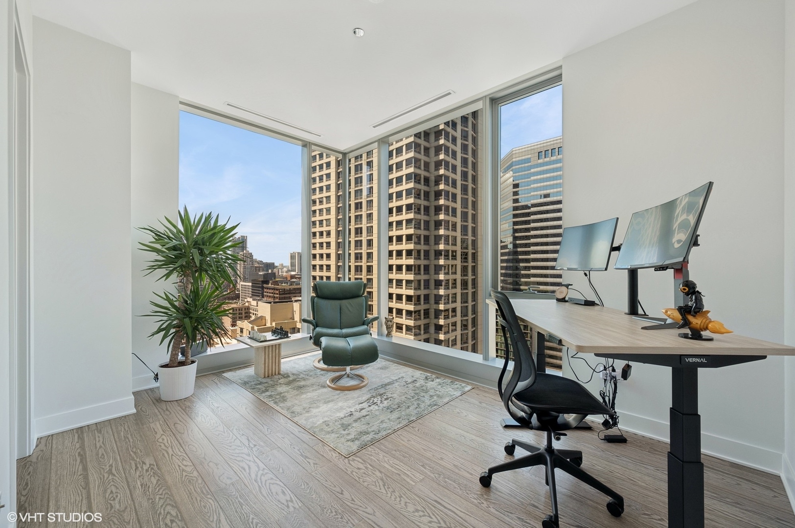 403 North Wabash Avenue, Unit 17C Chicago, IL 60611 - Photo 19 of 30 a view of a workspace with furniture and a potted plant