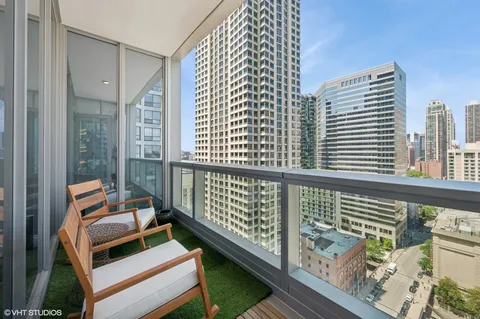 a balcony with an outdoor seating