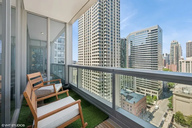 a balcony with an outdoor seating