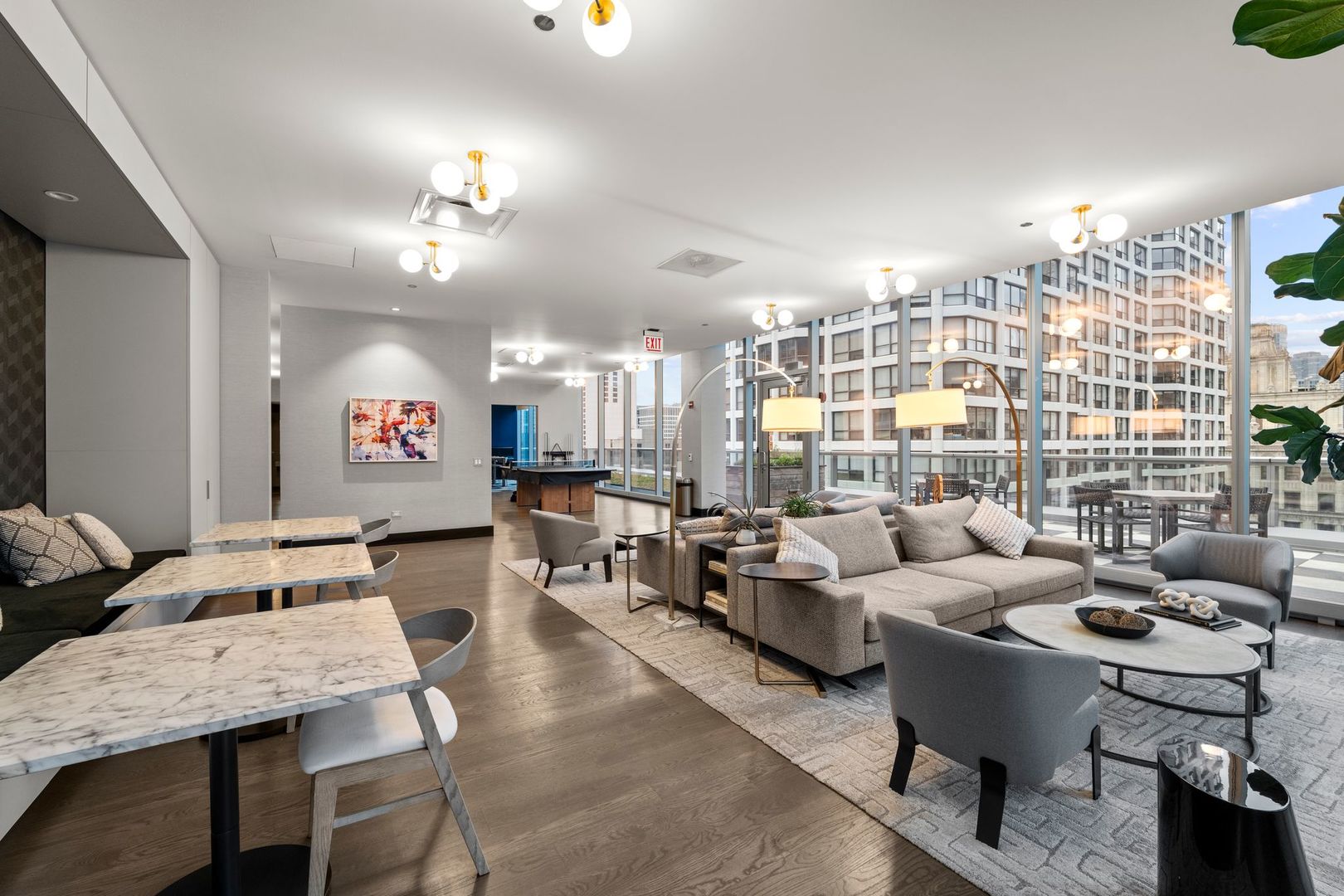 403 North Wabash Avenue, Unit 17C Chicago, IL 60611 - Photo 27 of 30 a living room with furniture kitchen view and a chandelier