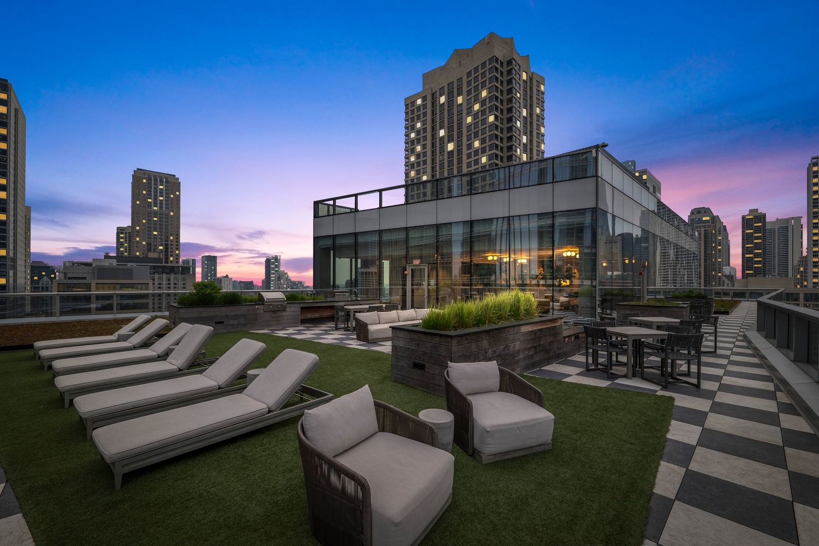 403 North Wabash Avenue, Unit 17C Chicago, IL 60611 - Photo 29 of 30 a view of a patio with couches table and chairs and potted plants