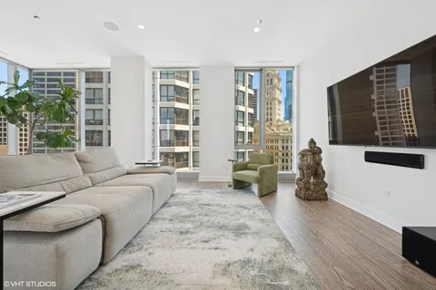 a living room with furniture window and wooden floor