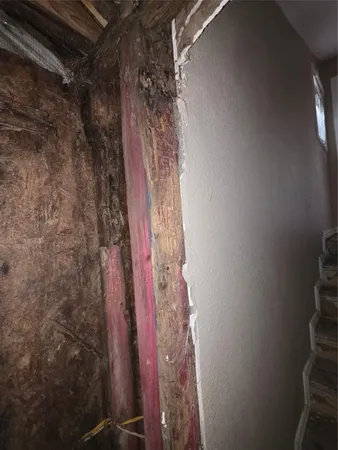 a bathroom with a window and a shower