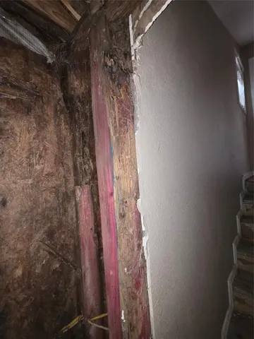 a bathroom with a window and a shower