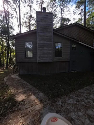 a bedroom with a bed and cabinets