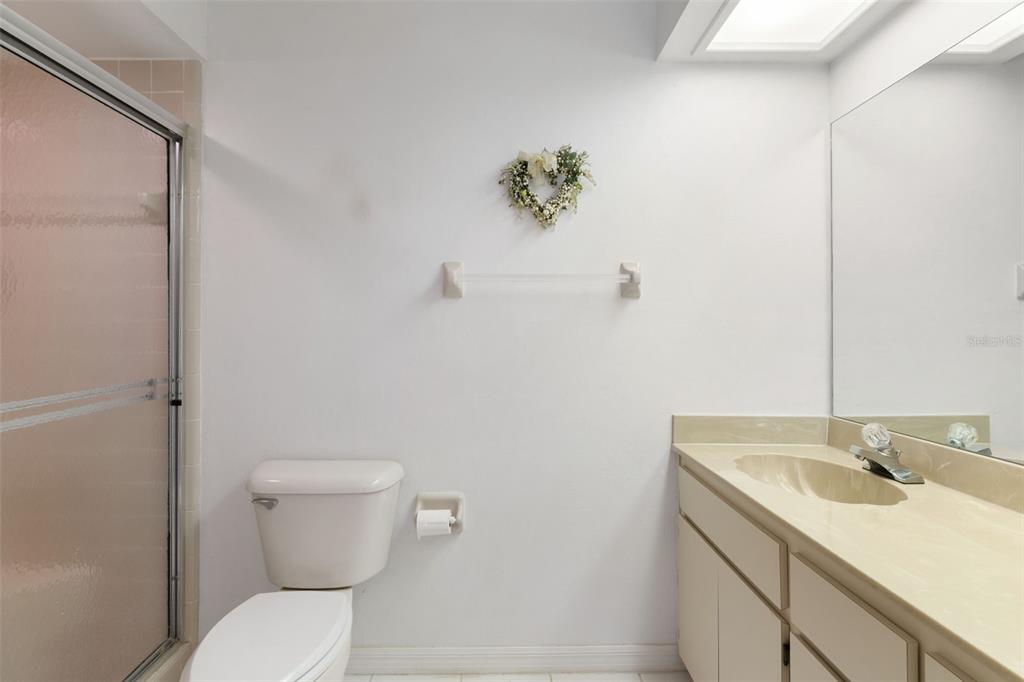 6606 Brambleleaf Drive Spring Hill, FL 34606 - Photo 26 of 79 a bathroom with a sink a toilet and a mirror