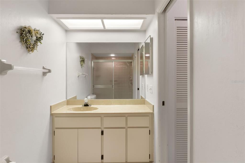 6606 Brambleleaf Drive Spring Hill, FL 34606 - Photo 27 of 79 a bathroom with a sink and a mirror