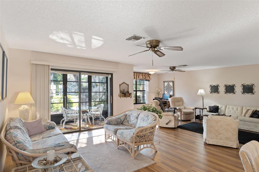 6606 Brambleleaf Drive Spring Hill, FL 34606 - Photo 5 of 79 a living room with furniture ceiling fan and a window