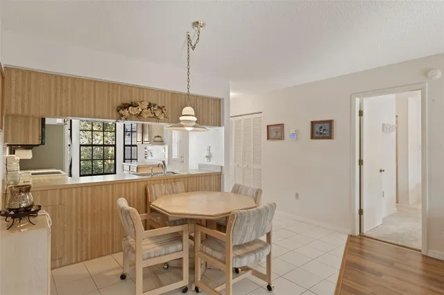 a kitchen with a sink appliances and cabinets
