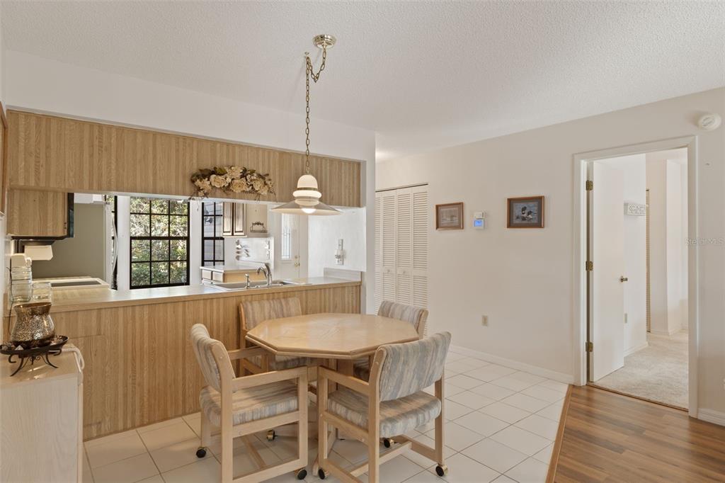 6606 Brambleleaf Drive Spring Hill, FL 34606 - Photo 10 of 79 a view of a dining room with furniture and chandelier