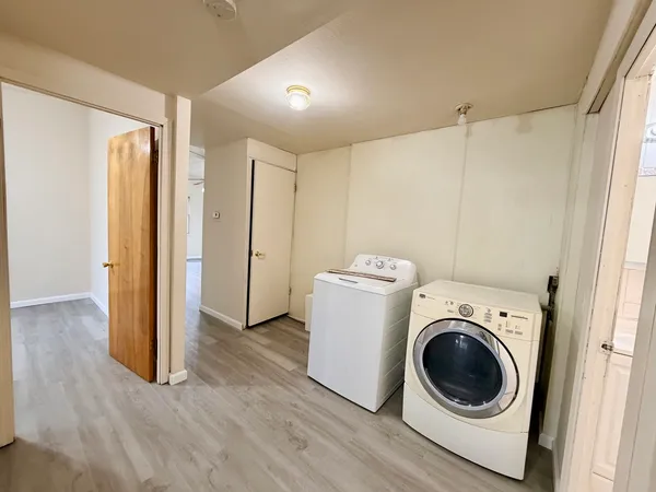 a view of a storage & utility room with washer and dryer
