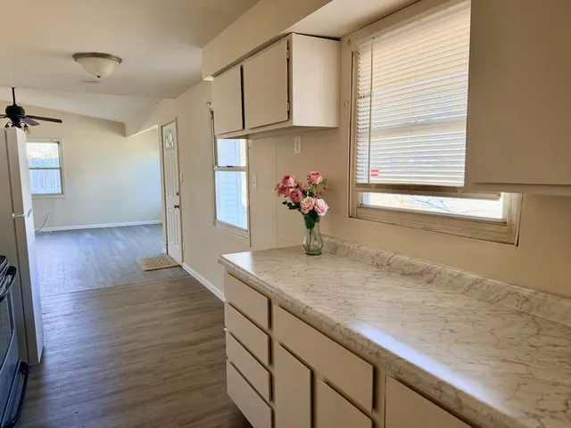 a kitchen with a sink and a window