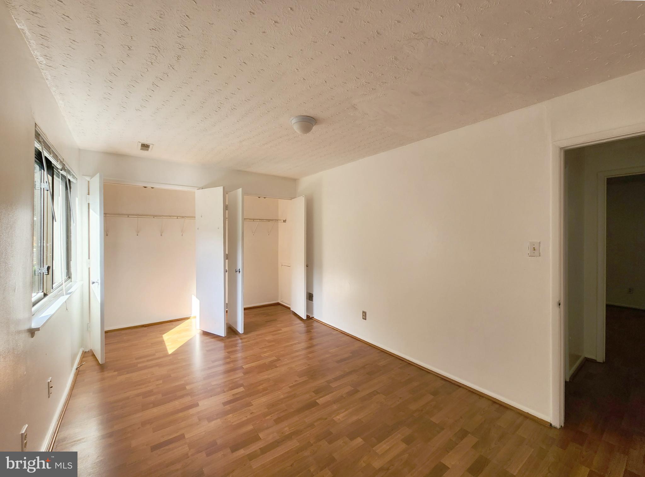 1710 Westwind Way McLean, VA 22102 - Photo 14 of 25 a view of an empty room with wooden floor and a window