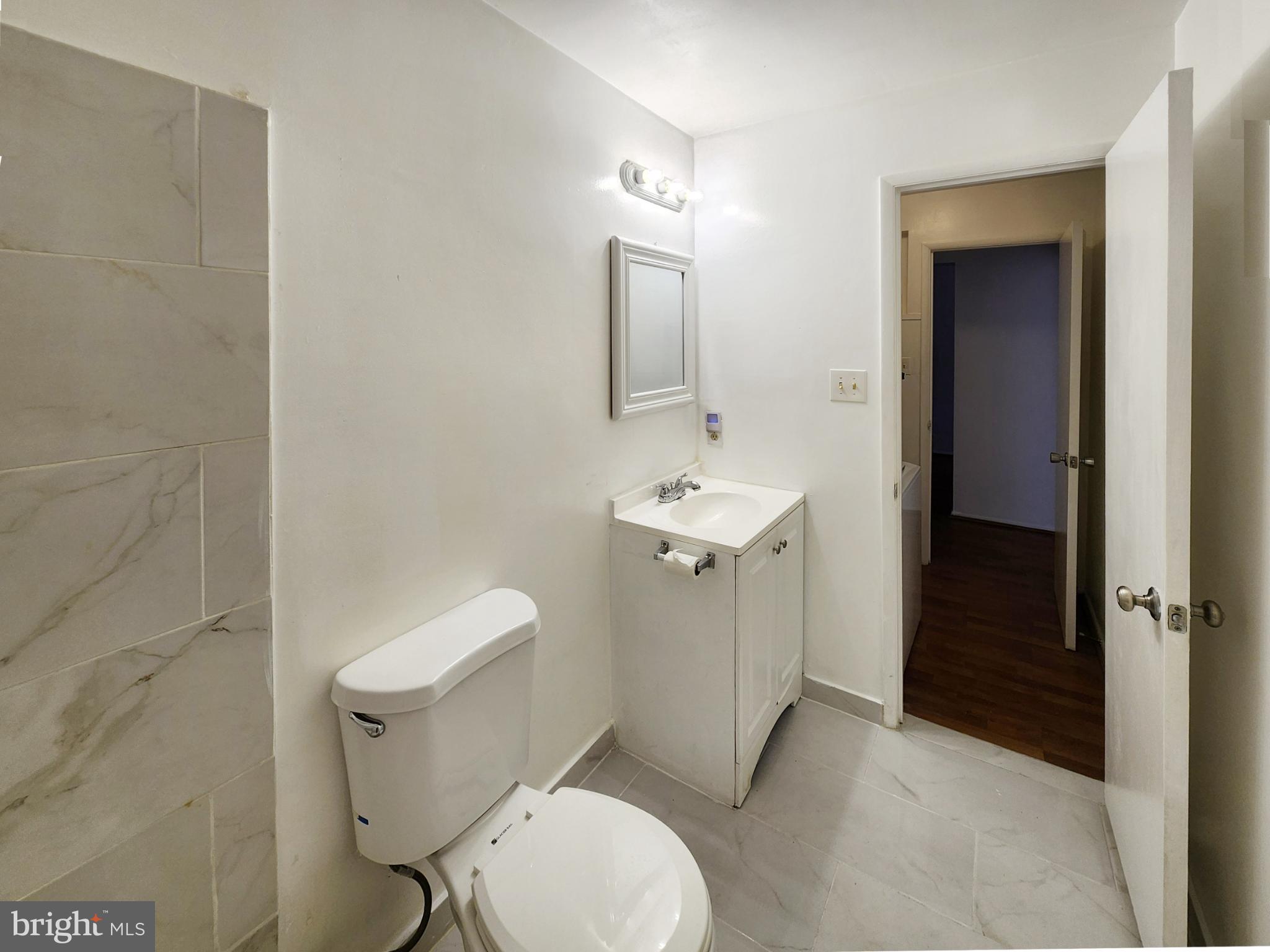 1710 Westwind Way McLean, VA 22102 - Photo 16 of 25 a white toilet sitting next to a bathroom sink