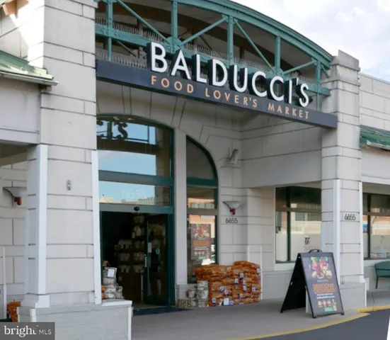 a view of outdoor space with sign board and garden