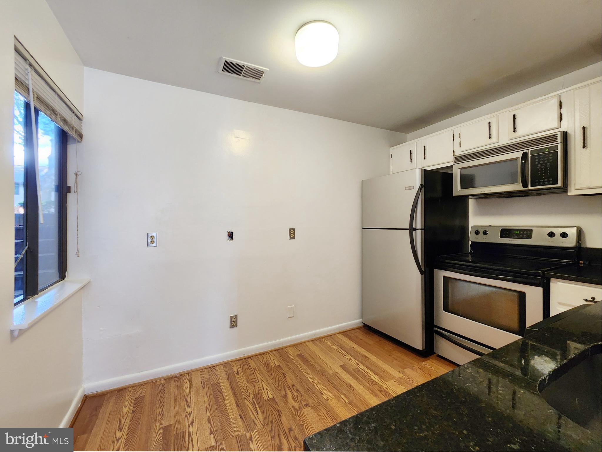 1710 Westwind Way McLean, VA 22102 - Photo 10 of 25 a kitchen with stainless steel appliances a refrigerator and a stove top oven