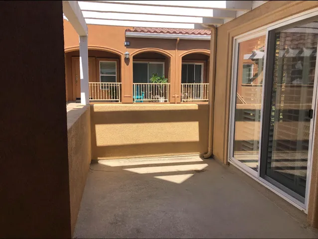 a view of front door of house with stairs