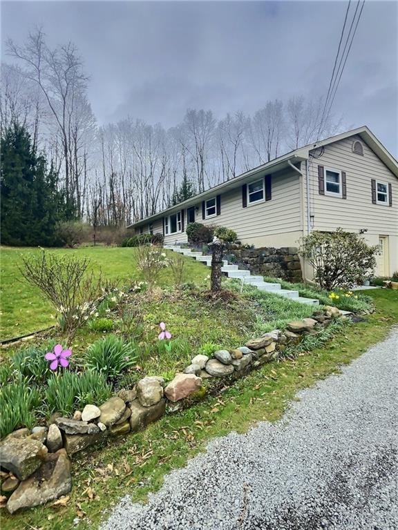 7749 Lamor Road Mercer, PA 16137 - Photo 17 of 17 a backyard of a house with a yard and outdoor seating