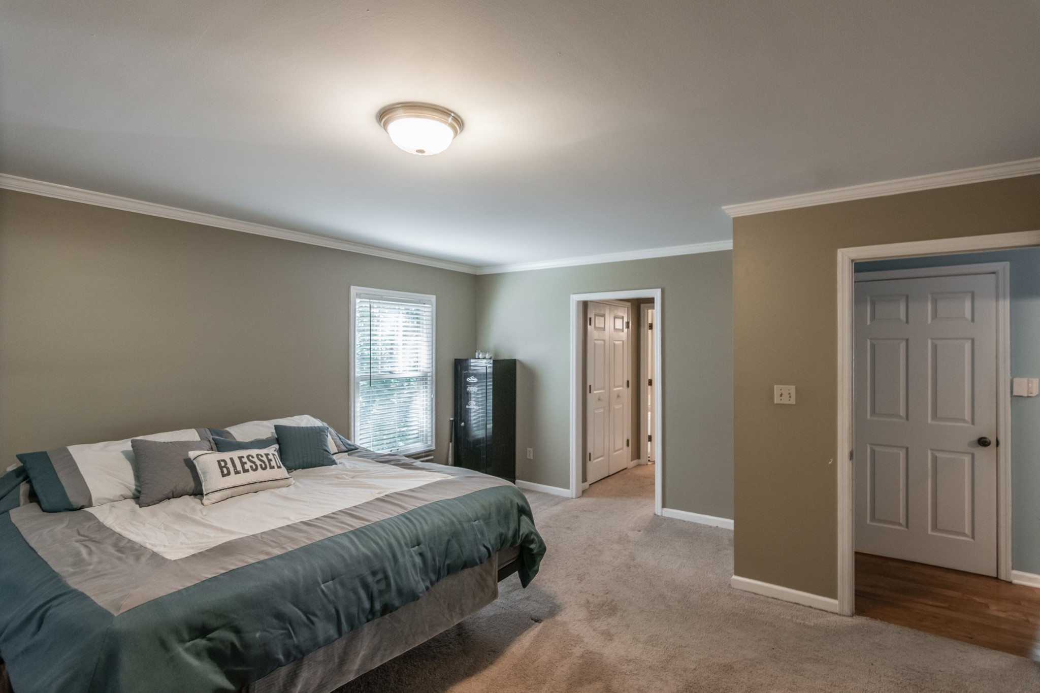 5207 Stacy Springs Road Springfield, TN 37172 - Photo 12 of 30 a bedroom with a bed and closet with mirror