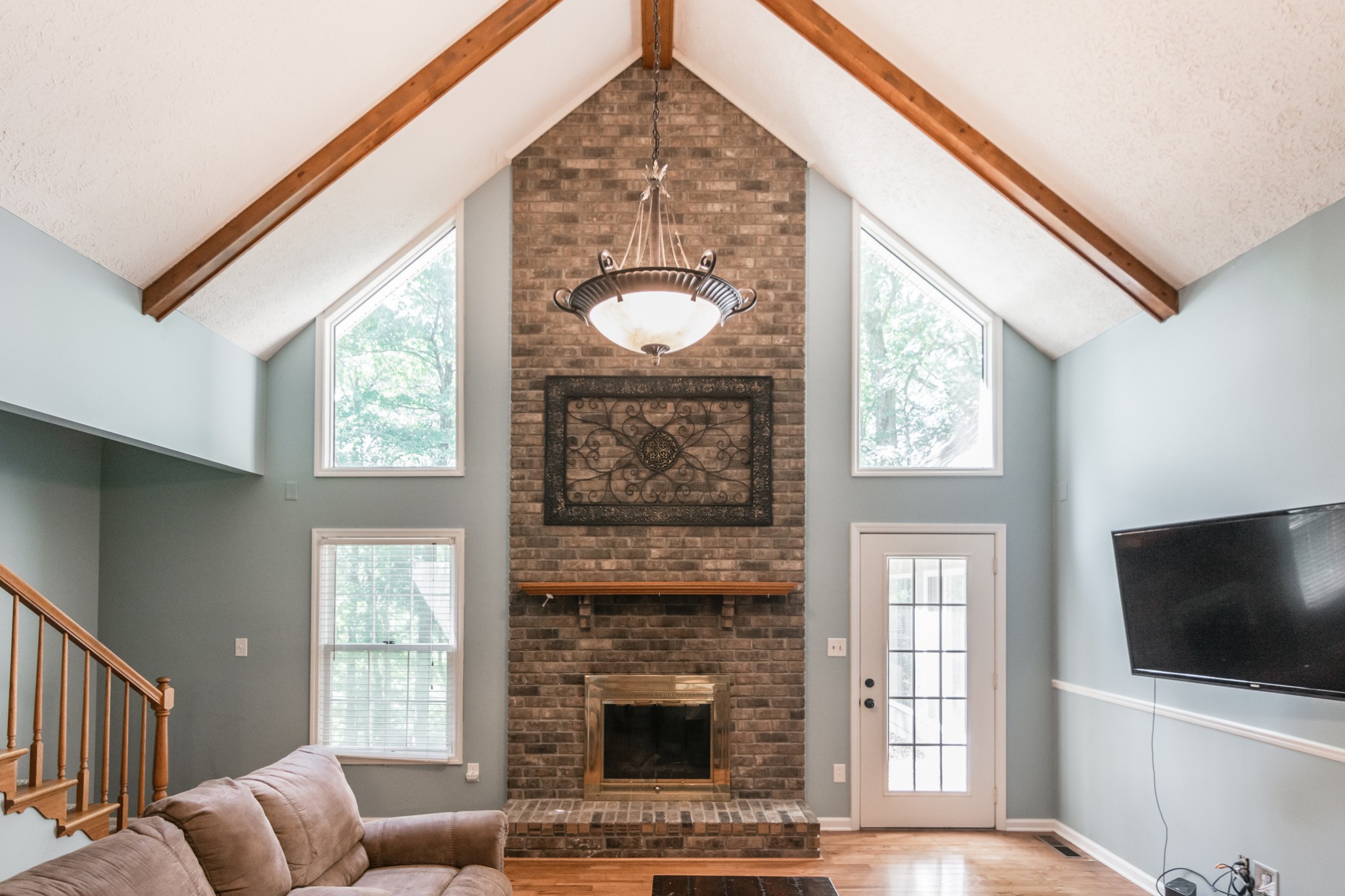 5207 Stacy Springs Road Springfield, TN 37172 - Photo 5 of 30 a living room with furniture a flat screen tv and a fireplace