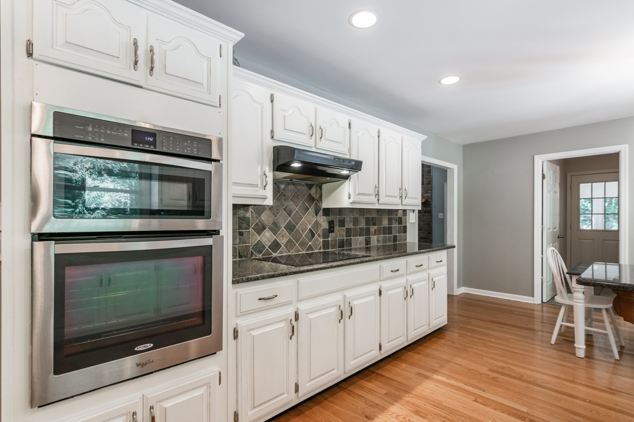 5207 Stacy Springs Road Springfield, TN 37172 - Photo 9 of 30 a kitchen with stainless steel appliances a stove microwave and cabinets
