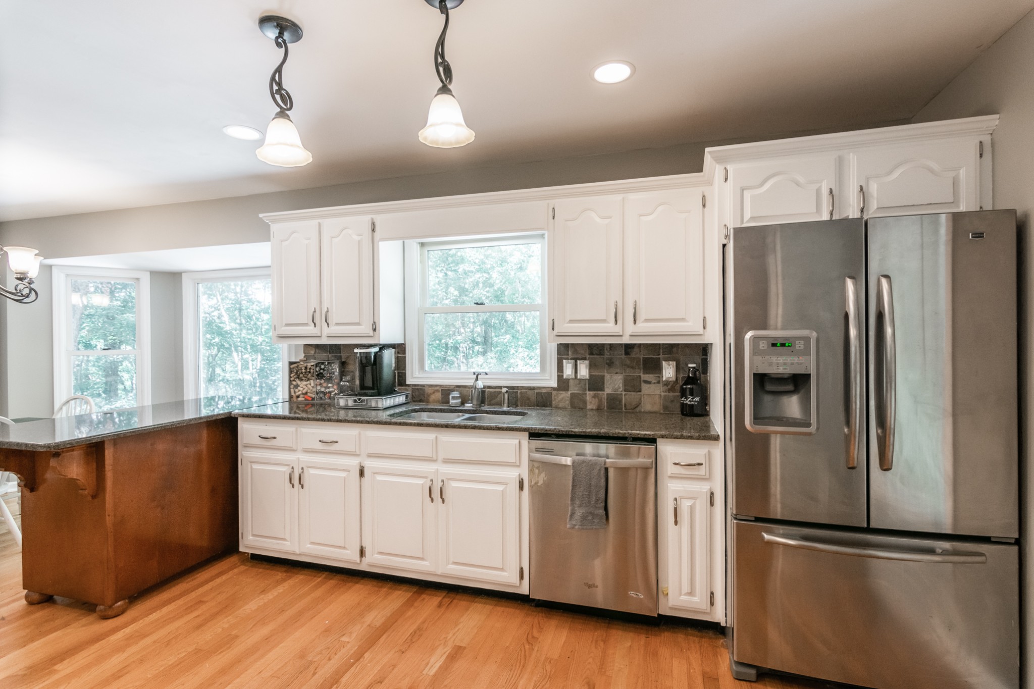 5207 Stacy Springs Road Springfield, TN 37172 - Photo 10 of 30 a kitchen with stainless steel appliances a refrigerator sink and cabinets