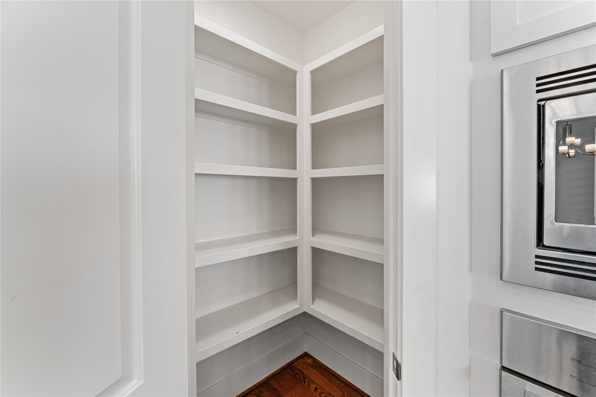 4938 Edison Park Lane Houston, TX 77081 - Photo 16 of 49 a view of walk in closet with empty racks