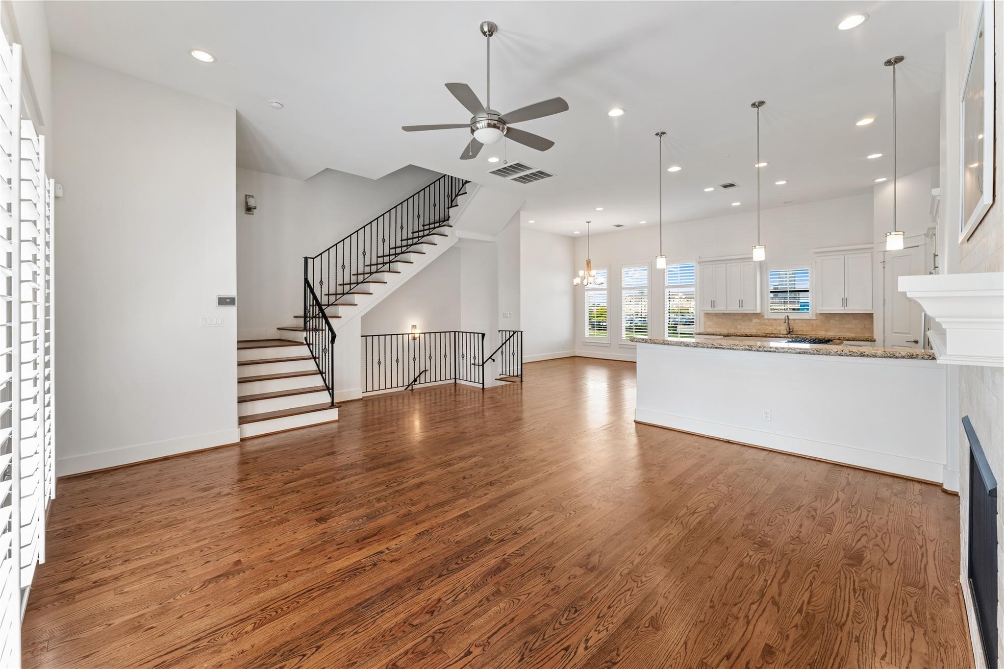 4938 Edison Park Lane Houston, TX 77081 - Photo 24 of 49 a view of a kitchen with furniture and wooden floor